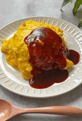 soft and fluffy eggs with fried rice and demi-glace sauce